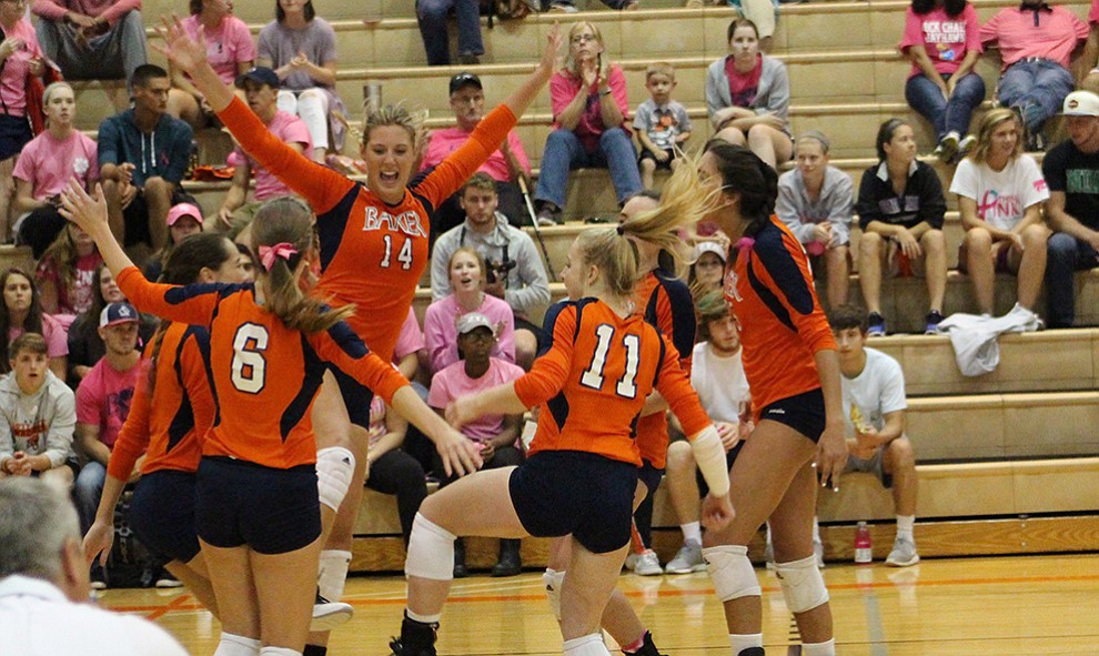 Sophomore+Olivia+Brees+celebrates+a+point+for+Baker.+The+Wildcats+won+the+match+in+four+sets.+Image+by+Elizabeth+Hanson.