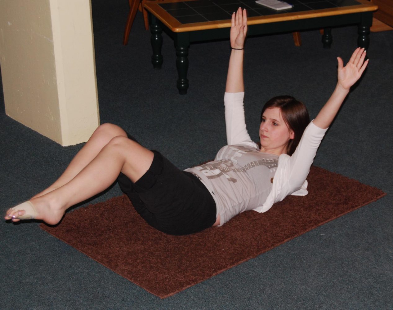 Resident assistant starts Pilates class in basement