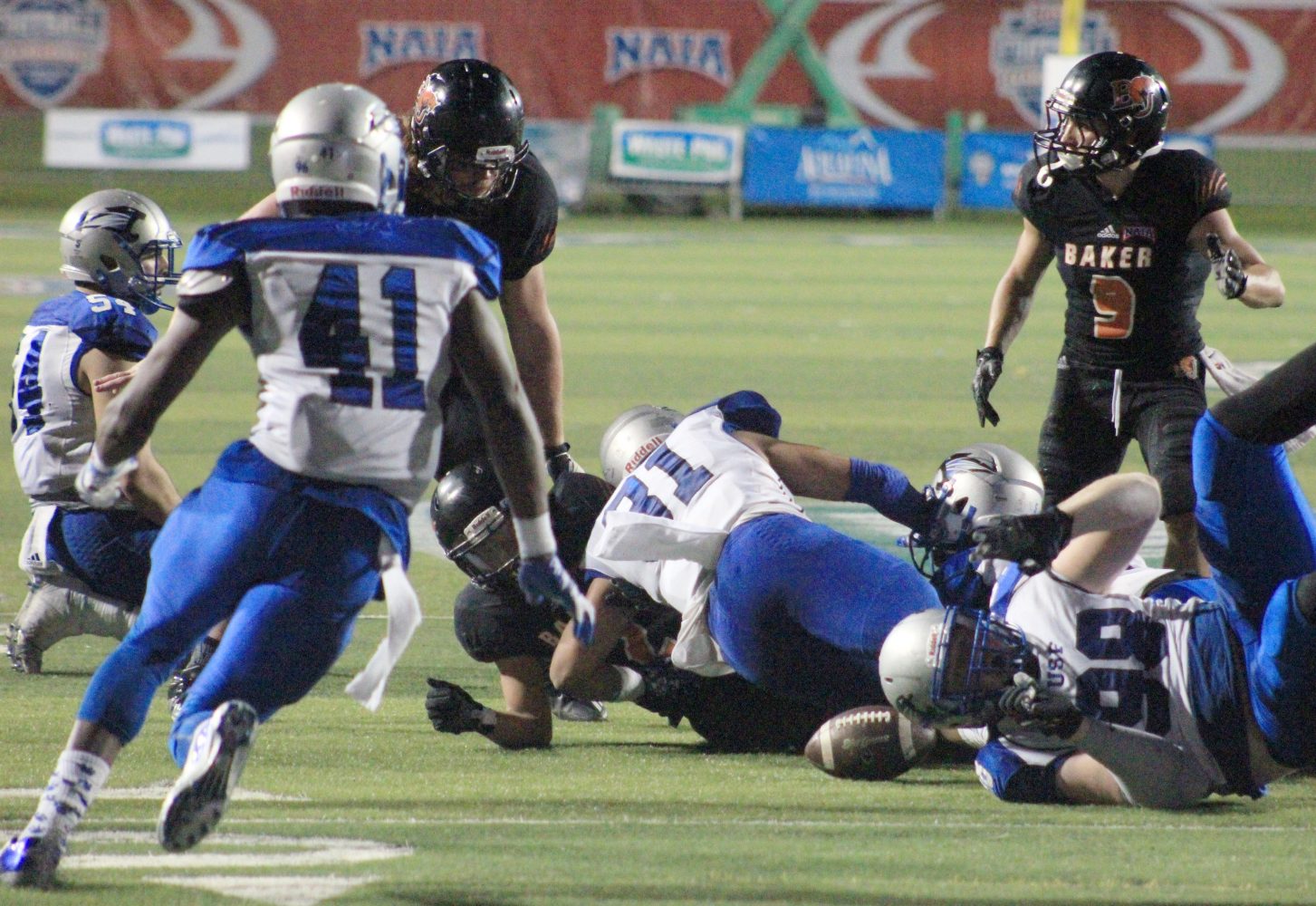 Saint Francis forces a Cornell Brown fumble in the fourth quarter of the national title game in Daytona Beach, Florida. The Cougars forced two Baker turnovers in their 38-17 win. Image by Shelby Stephens.