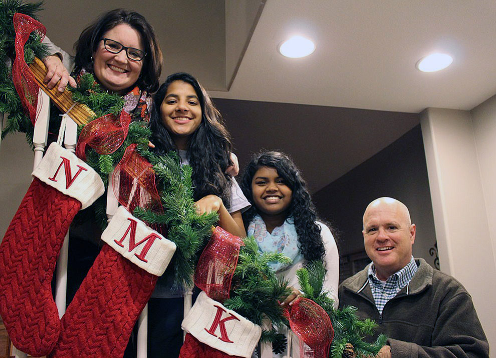 Reverend Kevin Hopkins with his wife Joni and two adopted daughters, Selci and Divya. Image by Jenna Black.