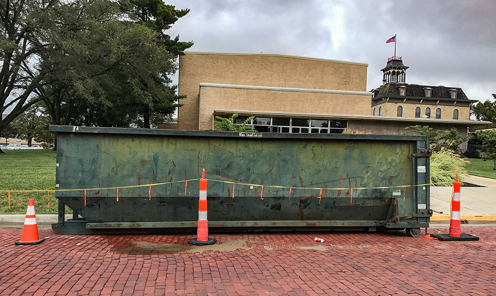A dumpster sits in front of Rice Auditorium as renovations are still under way. It is expected to be completed in time for Fall Commencement in Dec.