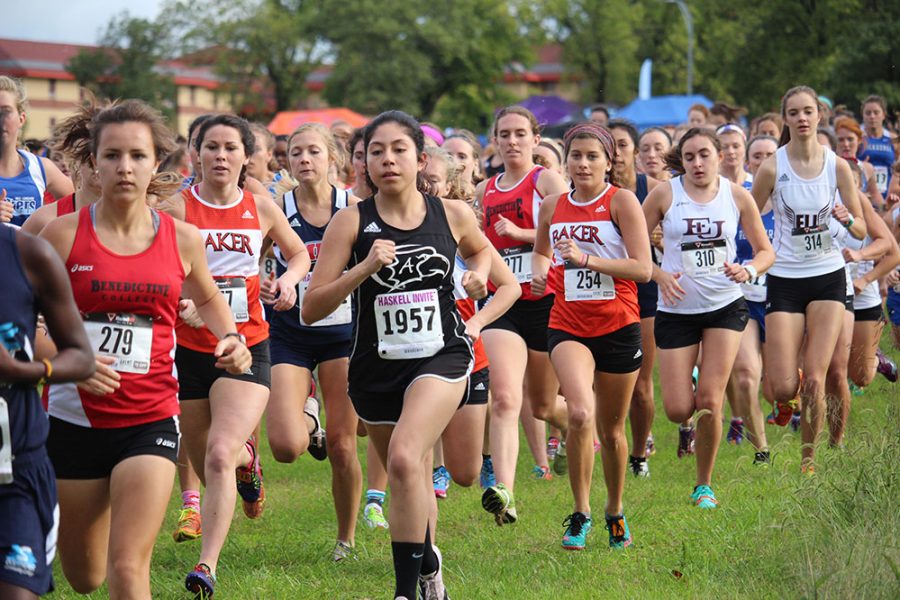 Womens collegiate runners take off at the sound of the starting gun for the first race of the day at the Haskell Indian Nations University Invitational on Oct. 7. Along with the two collegiate races, Haskell welcomed area high school teams as well.