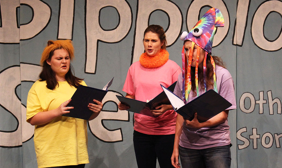 Freshman Morgan Masters and seniors Destiny Bruno and Alyssa Glover act as made-up Seuss characters. The actors read the book word for word to capture the entirety of Dr. Seusss writings.