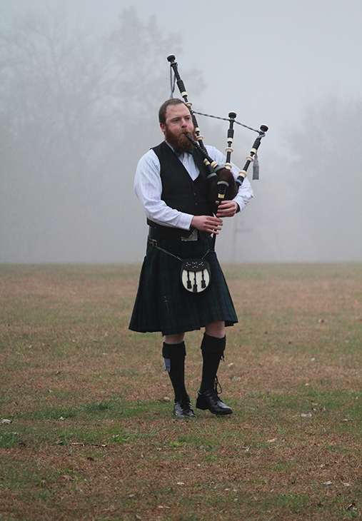 A bagpiper plays during the opening ceremonies for the Heart Championship race on Nov. 4. Following the bagpipe performance was the national anthem sung by Baker cross country alumna, Rachel Emmanuels.