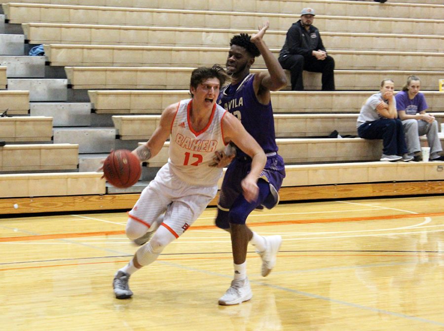 Senior Nate Guscott drives to the basket against an Avila defender inside Collins Center on Wednesday. The Wildcats won the Heart opener 85-65 and Guscott led all scorers with 18 points.