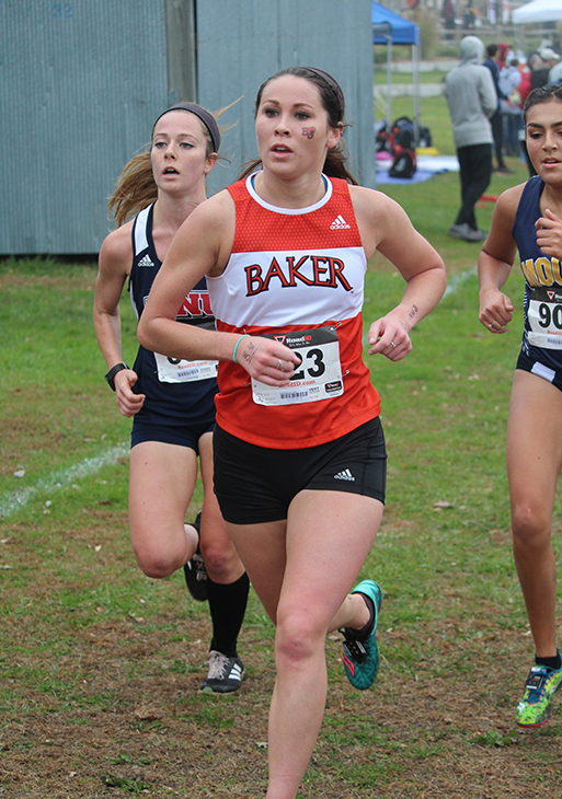 Approaching the two mile point in the 5 kilometer (3.1 miles) race, senior Rosie Hollis runs in her final collegiate cross country race. Hollis led the womens team by finishing in 18th place.