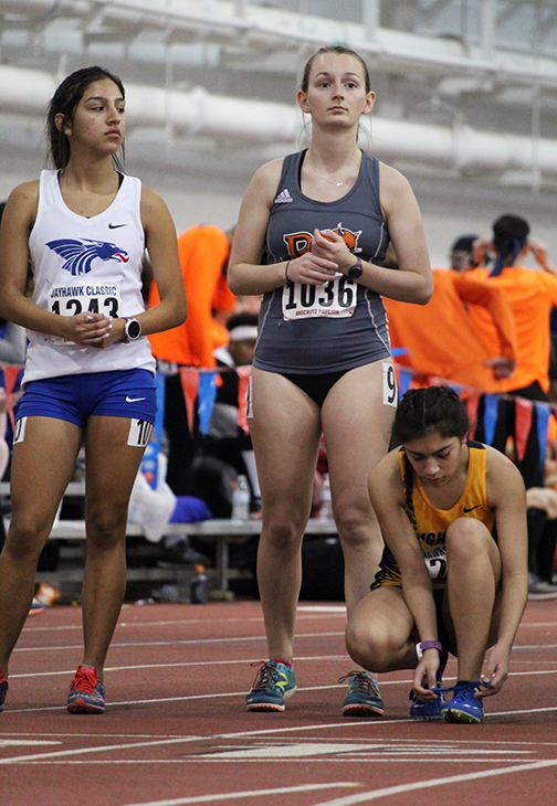 Junior Jenna Black stands at the starting line and prepares for the womens 3k race. Black set a new personal record of 11:44.16 at the Jayhawk Classic, beating her previous personal record of 11:49.97 also set this season at the JCC Cavalier Night Indoor Relays on Jan 19. 