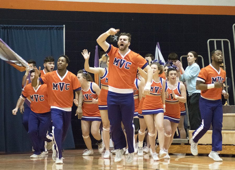 Missouri Valley Colleges cheer team runs onto the court to perform in the Baker Classic. Missouri Valley won the competition with 84.08 points.