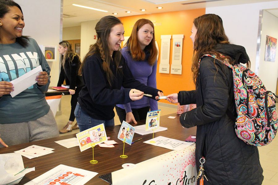 Freshman Megan Emerson and other members of Delta Delta Delta host a Valentine booth inside the Harter Union. The sorority is selling candy and flowers to be delivered on Feb. 14. All proceeds will benefit St. Jude Childrens Research Hospital.