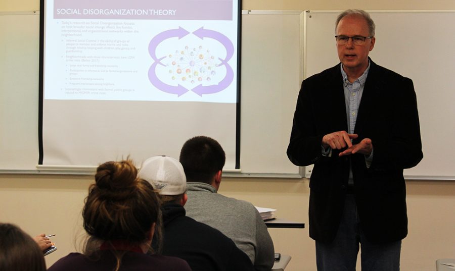 Professor of Sociology Tim Buzzell teaches his criminology class on March 7. The Kansas City Police Department also presented to the class and all who are interested in law enforcement on March 21.
