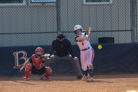 Sophomore Hannah Flynn gets a hit against Benedictine on March 9. Flynn has a .343 batting average this season with two home runs and 17 RBIs.