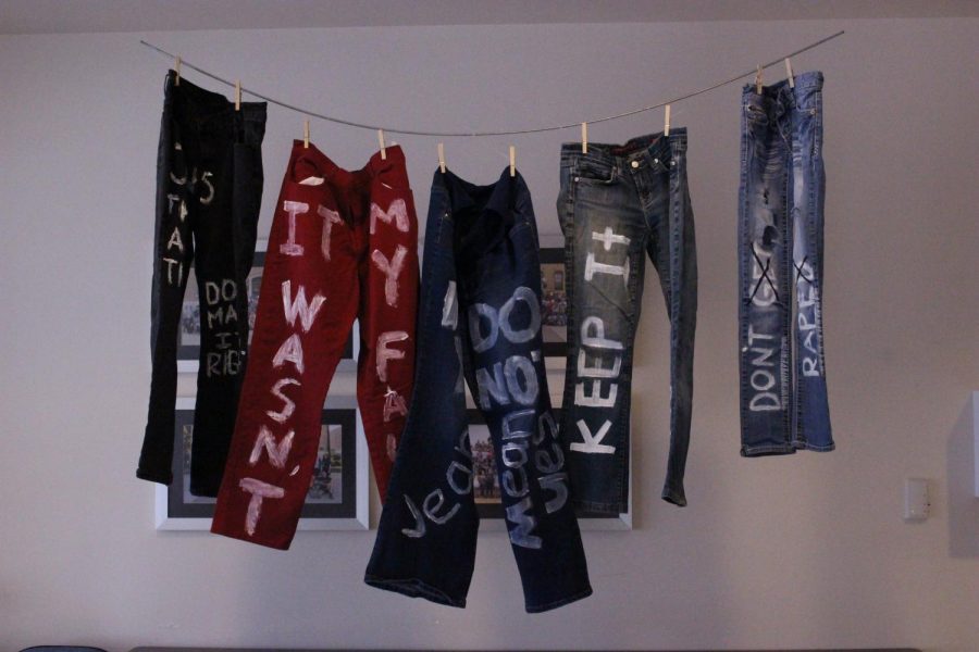 BRäV hangs jeans with words on them to advocate against and spread awareness about sexual assault on campus. The group members painted sayings such as It wasnt my fault on the pants to encourage people to stop victim blaming.
