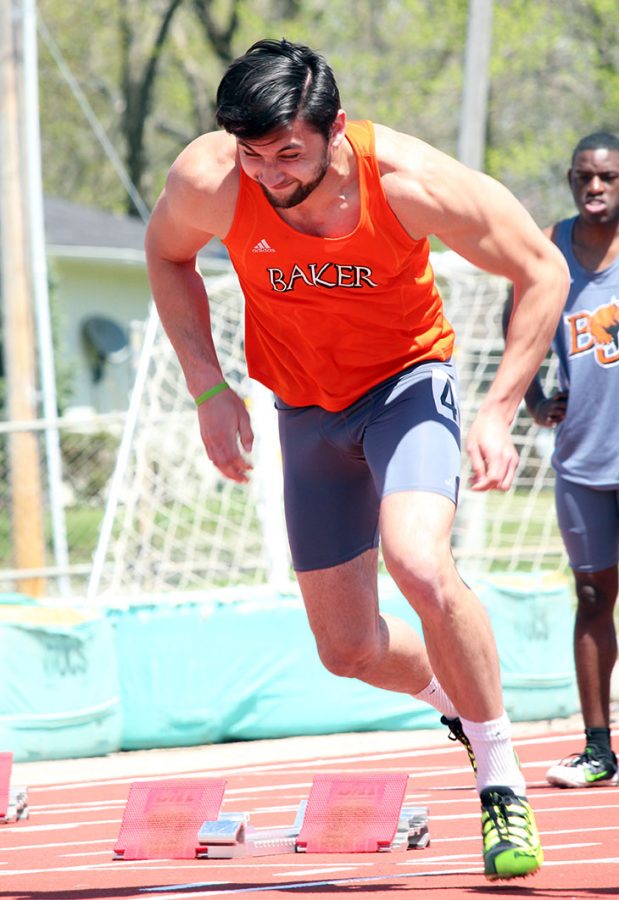 Exploding out of the starting blocks, freshman Jack Taylor begins the mens 100 meter dash. Taylor sprinted his way to a seventh place finish.