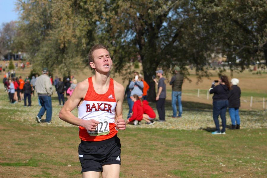 In the final stretch before the finish, Freshman Jackson Caldwell demonstrates just how demanding cross country is on the body. Caldwell has been a star this season for the mens team, consistently maintaining the number two spot, behind Senior Greg Flores.  