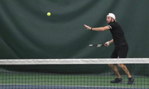 Junior Carson Fitzgerald prepares his forehand to return a hit by a Cowley County opponent. The Wildcats lose the match up with CCCC 1-6.
