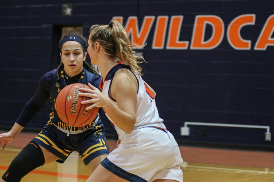 Freshman Macey Frost takes the ball down court during Saturdays game against Mount Mercy. The Wildcats won 59-55.