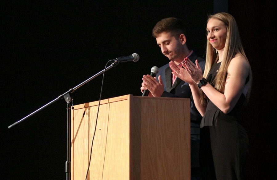 Current president of Zeta Chi, Dylan Kort and current Tri Delta President, Kayelee Smith host the annual Greek Awards Night in Rice Auditorium. 