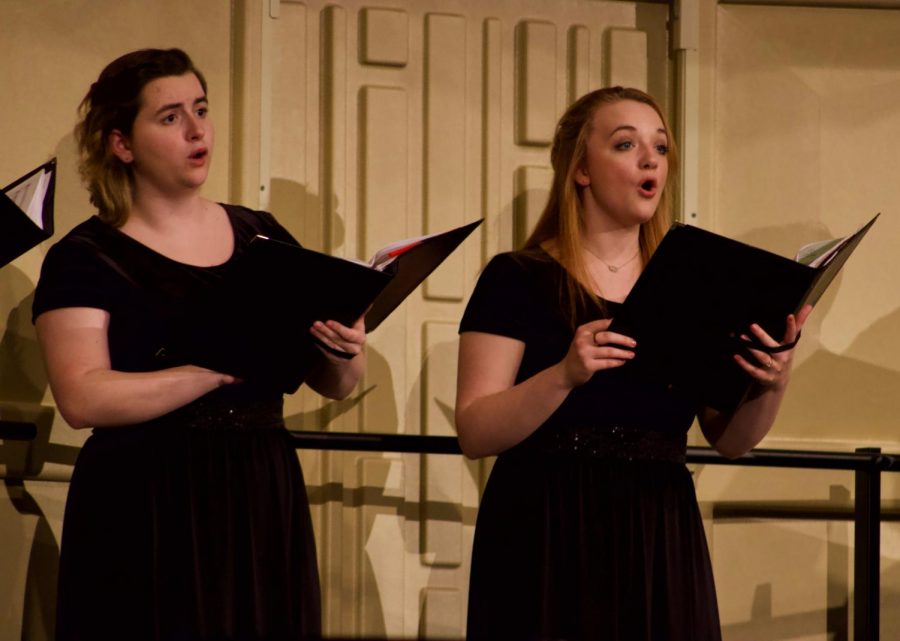 Senior Rose Ulrich and junior Celeste Kincaid singing during their performance held on March 10. Their concert was held in Rice Auditorium. The performers consists of students, faculty, and community members. 