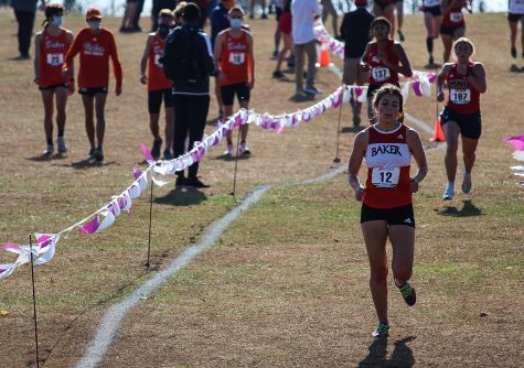 Junior Evelyn Roesner hustles to the finish line.