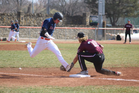 Sophomore Ryan Wetzel is called safe as he beats the ball to first base. 