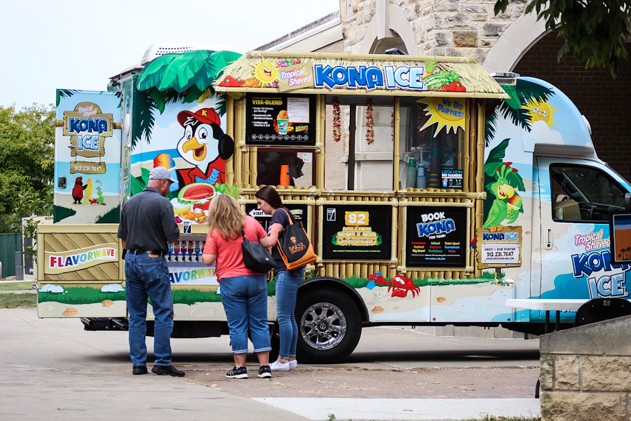 Families enjoy Kona Ice sponosred by Student Senate on their way out from Baker Bash.