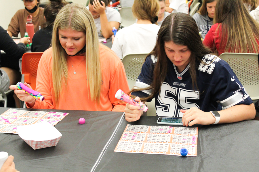Sophomores Taylor Brunton (left) and Katherine Heath (right) hope for a big win during Baker Bingo. 