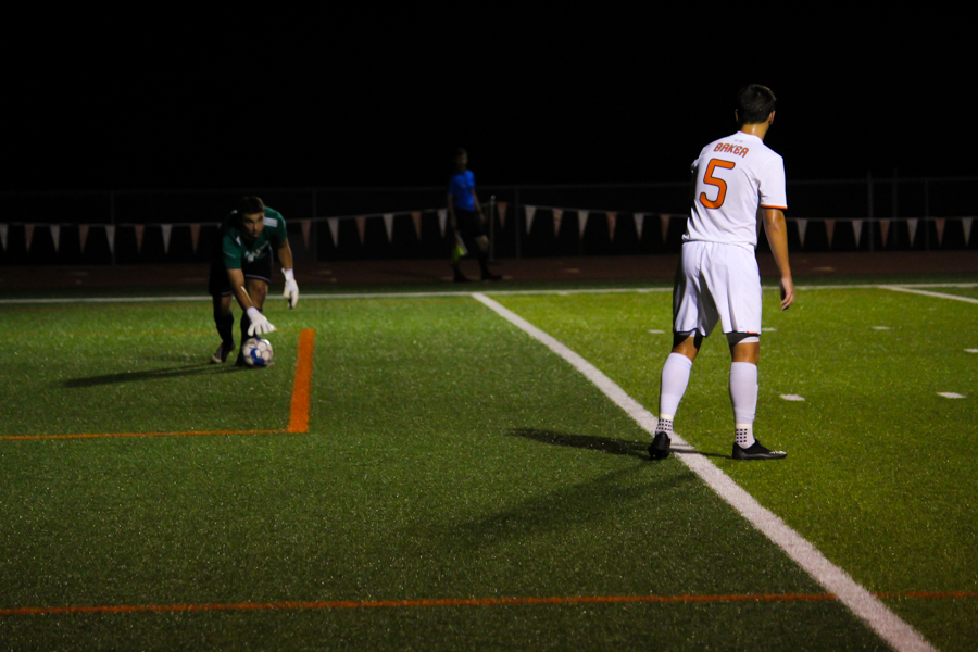 After protecting the goal, senior Rijad Osmankovic prepares to bring the ball up the field. 