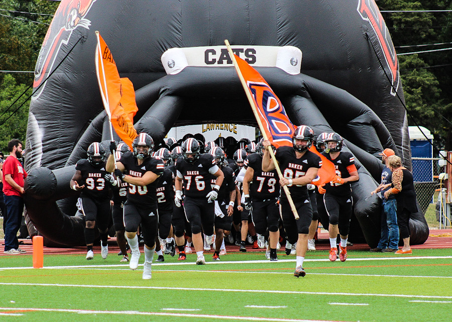 The Baker Wildcats enter the field for the start of the game against the Graceland Yellow Jackets on Oct 2.