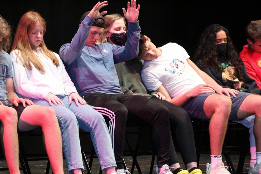 During Milligans act, volunteers fall asleep under hypnosis. Milligan began this process by having students do a series of relaxation techniques and by using their imagination.
