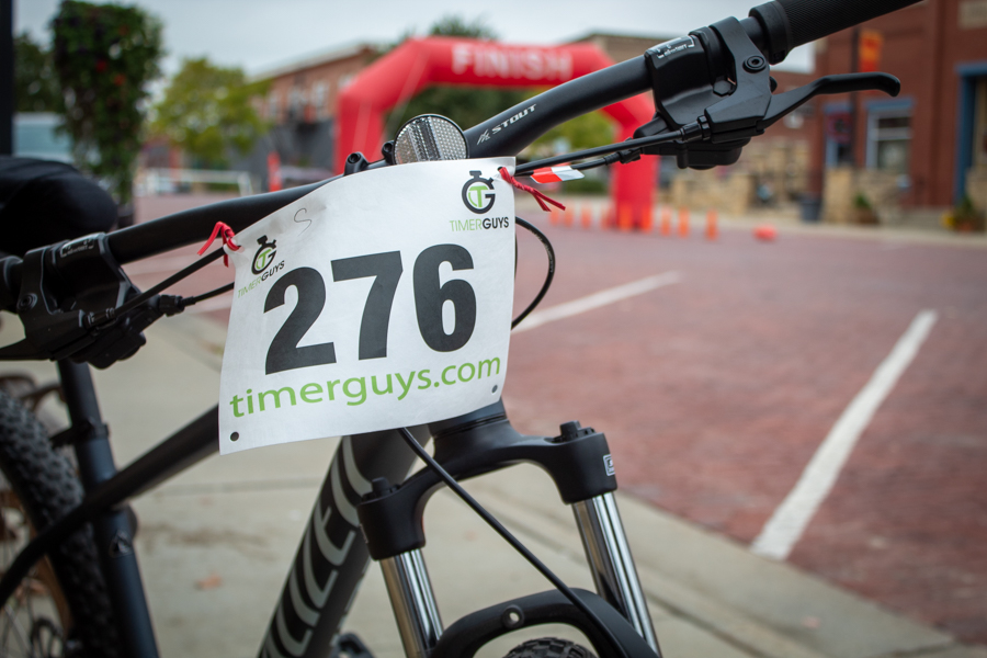 Timer Guys tracked each racer as they passed the finish line by giving each participant a number to put on the front of their bike.