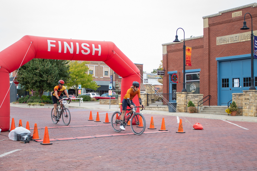 Bikers pass the finish line. Participants were able to see their finishing time on the Timer Guys website. 