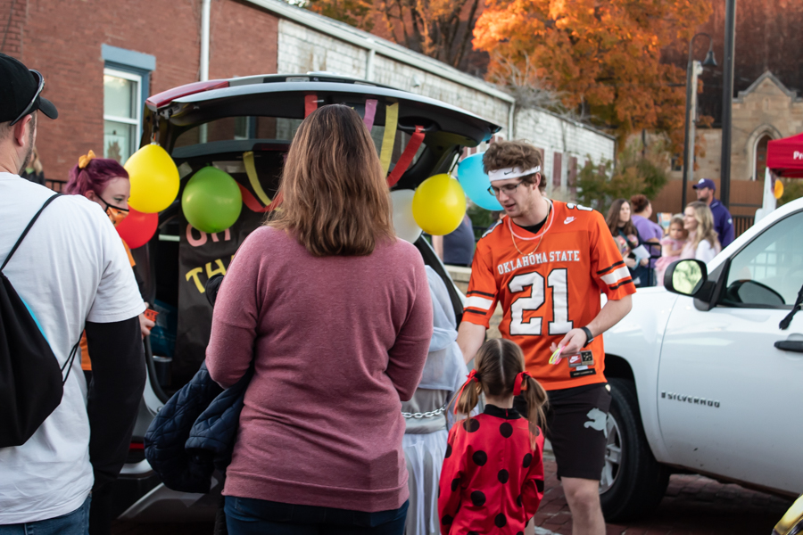 Baker School of Education decorated their trunk with a Dr. Seuss theme as Sophomore Brodie Pollock hands candy to those in line.