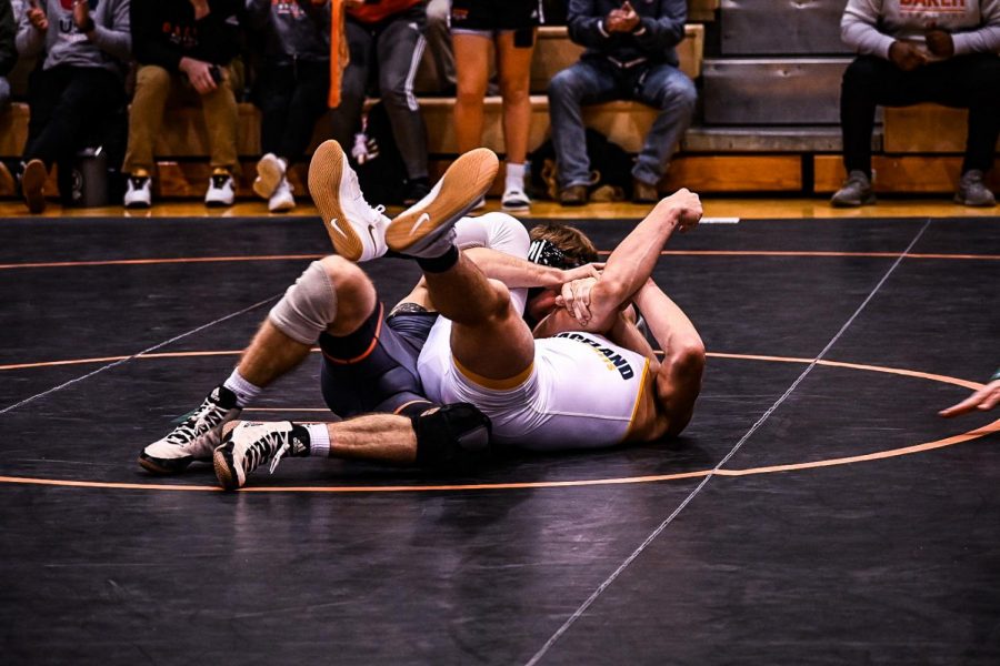 Junior Levi Green puts his opponent on his back to take the win.