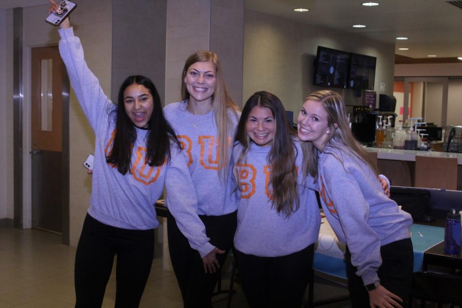 Baker students kick off the Awkward Family Photo event with matching BU sweatshirts.
 