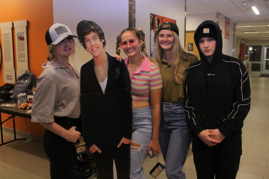 This group used a cardboard cut out of Pop singer Harry Styles as an addition to their family. 