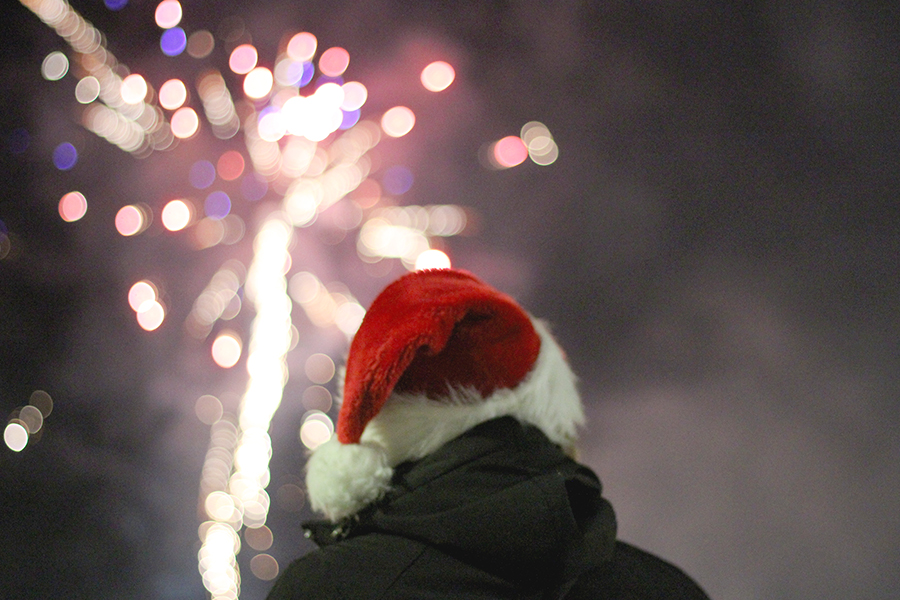 During the finale of the Hometown Christmas festival, the crowd watches the fireworks display.