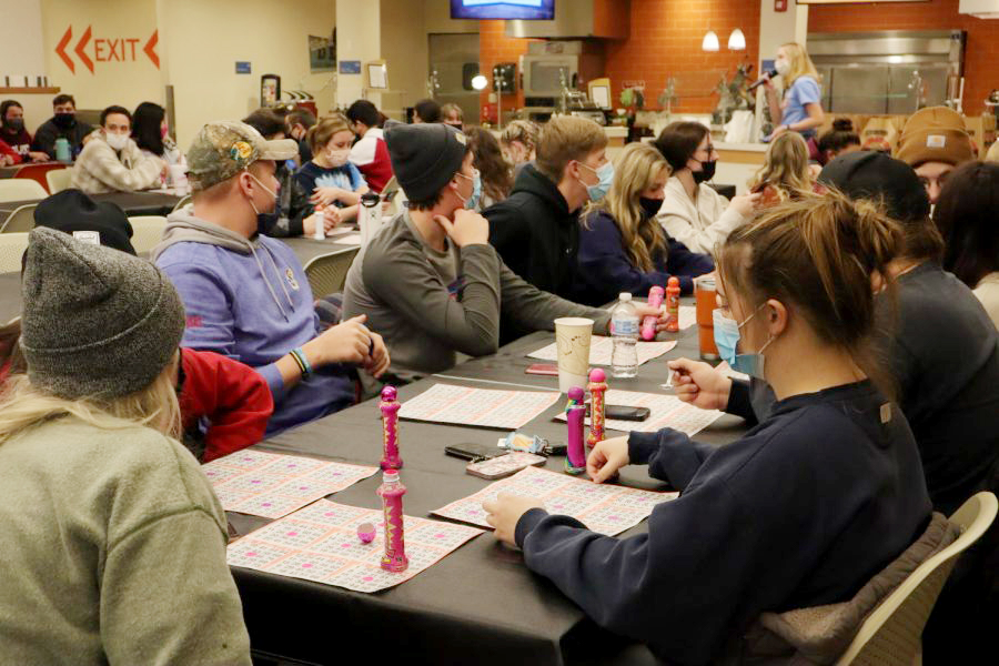 Students listen to grocery bingo host Sophomore Peyton Sannan as she calls numbers. Sannan serves as the Social and Cultural Issues Coordinator for SAC.