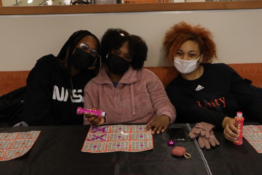 Junior Shelby Butts and Seniors Payton Johnson and Jaila Randle sit as a trio together during bingo.