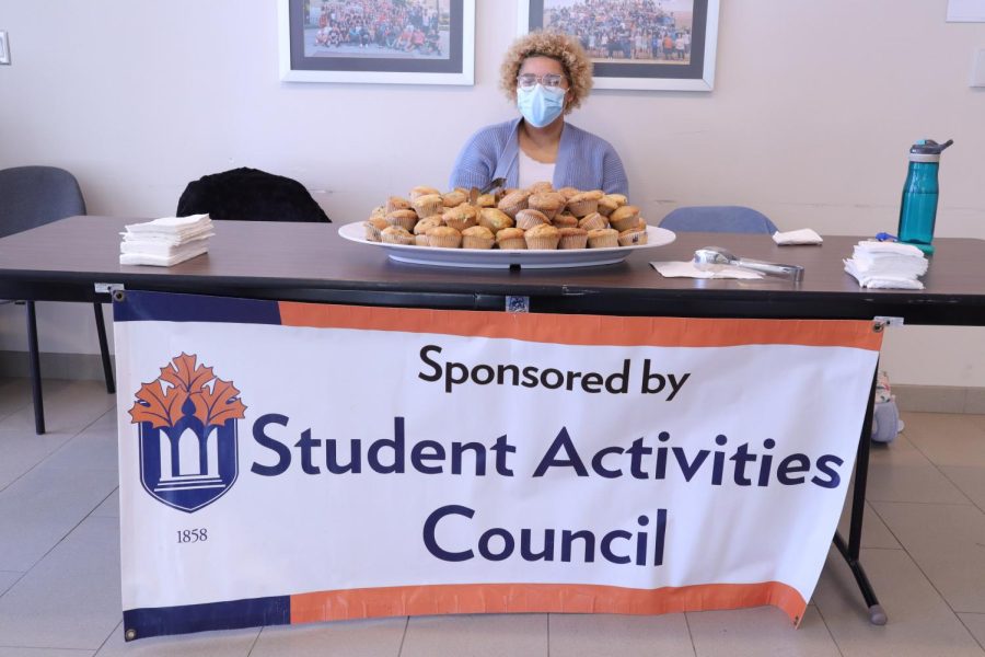 Student Activities Council member, Freshman Nguyen Nicholson works the muffin table in the Harter Union Lobby. Muffins were available from 11-1 p.m.