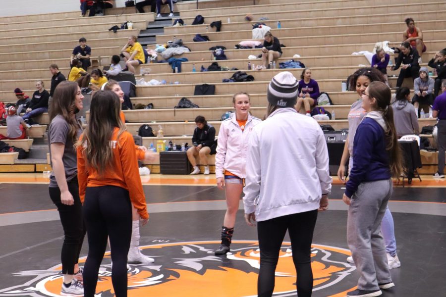 Members of the Womens wrestling team play a game of hacky-sac during intermission. 