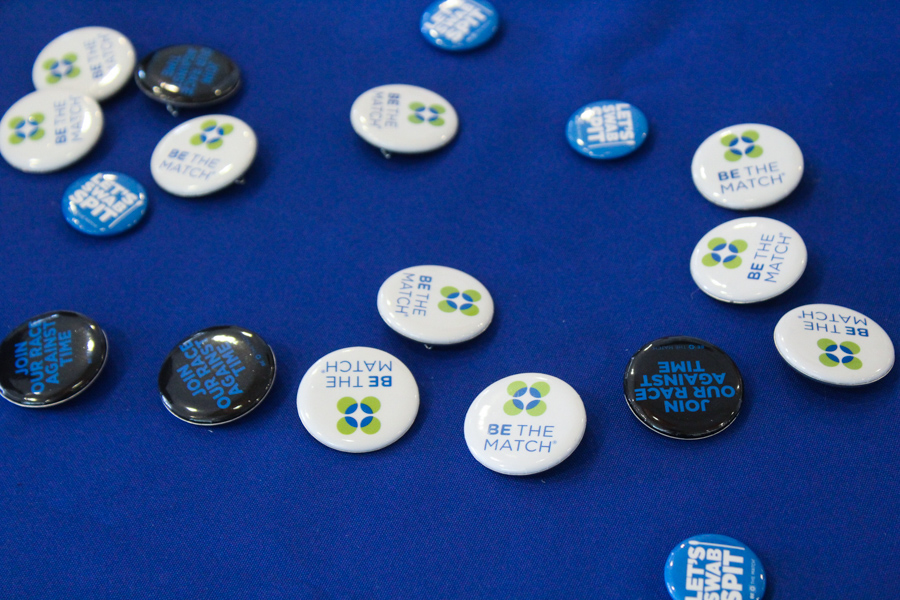 Buttons being handed out at Tuesdays tabeling event to inform students about donating bone marrow