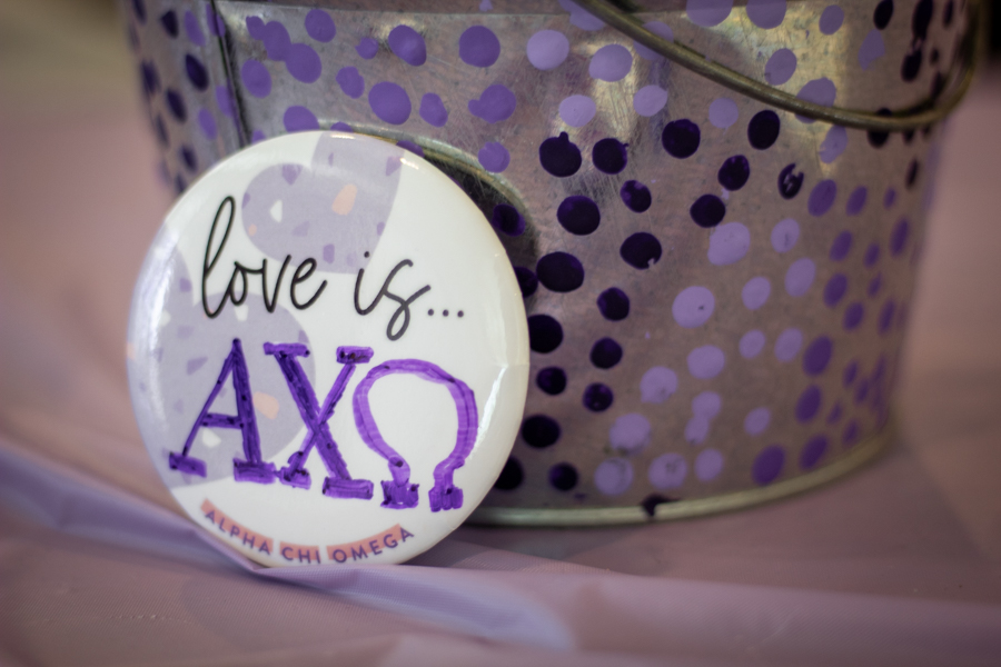 On Tuesday Feb. 8, Alpha Chi Omega members pass out Love Is... buttons. Students were encouraged to fill the button with what love means to them.
