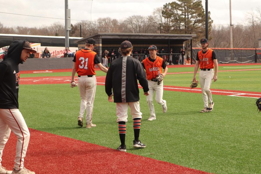Bakers defense switches to offense after striking out Doane. 