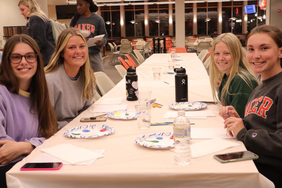 Seniors Kylee Reeves and Claire Chapman, Sophomore Brooke Allen and Junior Jordan Smith (left to right) spend the evening painting together. 