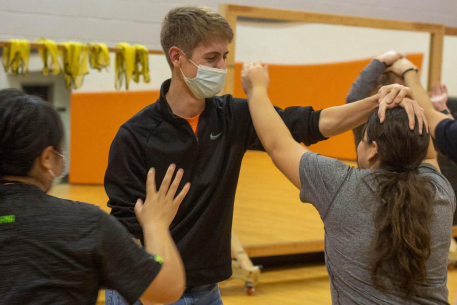 Sophomore Martha Vizcarra practices a tactic to evade a hair grab from Senior Garrett England.