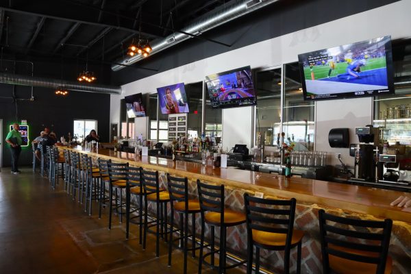 Baldwin City Beer Company displays a modern, sports bar-like interior. The brewery also contains several sitting areas. 
