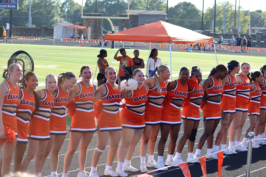 On Sept. 2 The Baker University Cheer team sings the Baker Alma Mater at the first home game of the season.