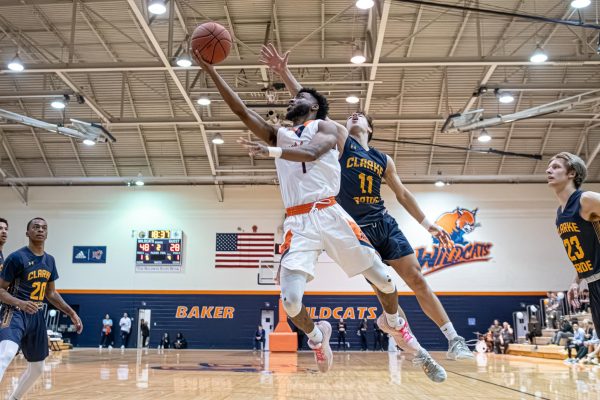 Senior guard Dylan Smith tries a second half layup against Clarke on Saturday.