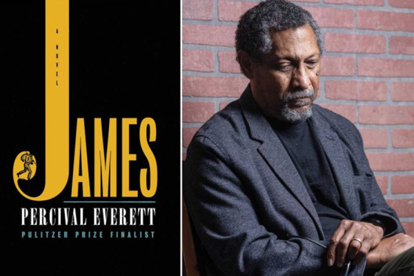 Author Percival Everett poses next to the cover of his novel "James".