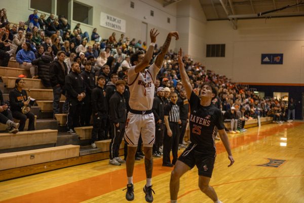 Kaiman Lennox scores a three pointer increasing the Wildcats lead to 22-15.